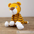 Load image into Gallery viewer, Crocheted tiger toy with yellow and brown stripes.