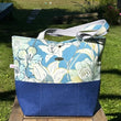Load image into Gallery viewer, Fleur tote bag front with floral design in blue
