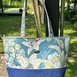 Load image into Gallery viewer, Fleur tote bag hanging with blue floral design