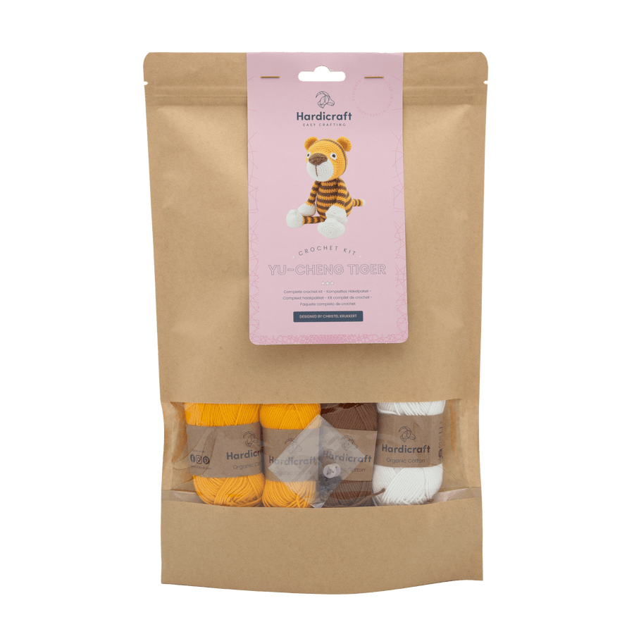 Brown paper bag with a tiger craft kit.