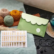 Load image into Gallery viewer, Bamboo Deluxe Interchangeable Set with 13cm needle tips and green storage pouch, perfect for knitting enthusiasts.

