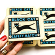 Load image into Gallery viewer, Notions Tin by Firefly Notes with black cat illustration and glossy resin finish.
