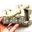 Load image into Gallery viewer, Notions Tin Firefly Notes - Peacock design tin for storing craft essentials and tools.
