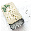 Load image into Gallery viewer, Notions Tin Firefly Notes featuring a vintage design of dogwood flowers on lid with stitch markers inside.
