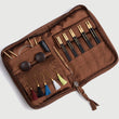 Load image into Gallery viewer, Lantern Moon Heritage Interchangeable Knitting Needle Set in a stylish brown case with colorful tassels and needle accessories.
