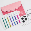 Load image into Gallery viewer, KnitPro Zing Midi interchangeable circular knitting needle set with colorful tips and accessories in a pink case.
