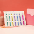 Load image into Gallery viewer, Zing Midi Interchangeable Circular Knitting Needle Sets by KnitPro displayed in vibrant colors on a soft background.
