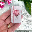 Load image into Gallery viewer, Notions Tin Firefly Notes featuring pink magnolia design held in a hand, showcasing vintage appeal and elegance.
