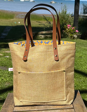Project Bags for Knitters and Crocheters made from up-cycled upholstery fabric with faux leather handles and exterior pocket.