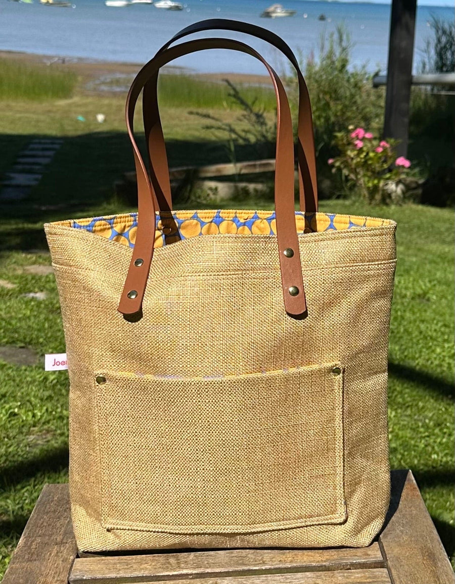 Project Bags for Knitters and Crocheters made from up-cycled upholstery fabric with faux leather handles and exterior pocket.